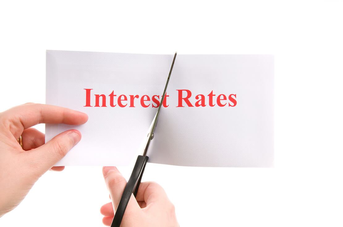 Scissors cutting interest rates in half