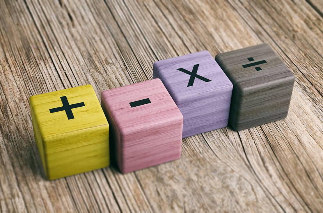 Math symbols on wooden blocks